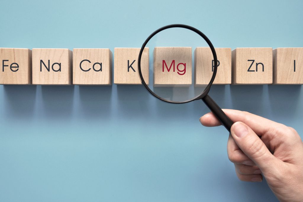 Magnifying glass on mineral symbol