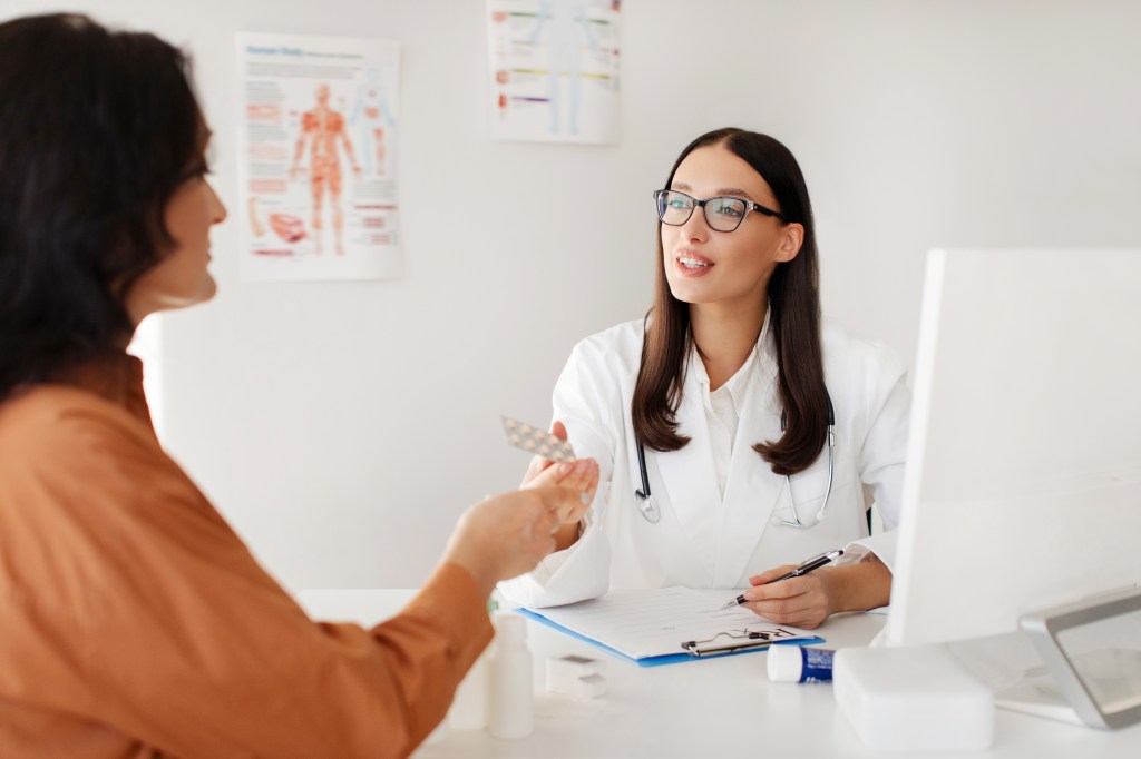 Woman talking to doctor 