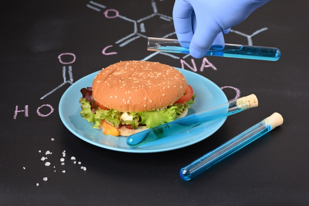 Pouring artificial dye on burger