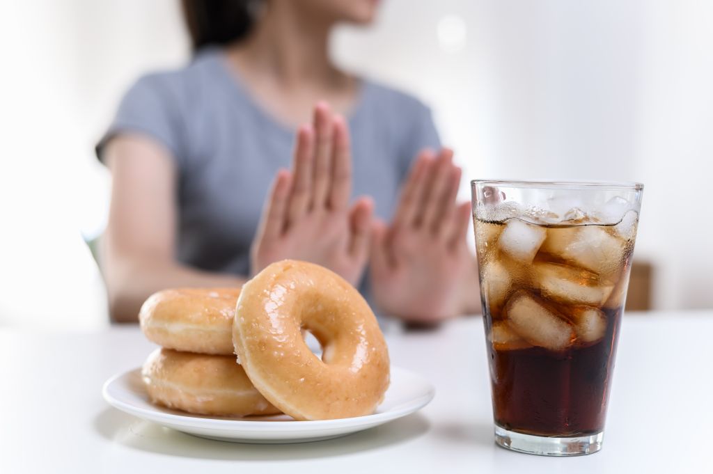Woman refusing sugary foods