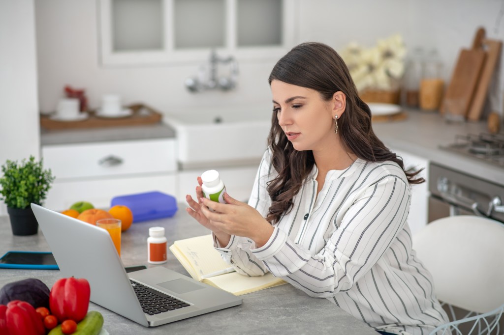 Woman researching supplement