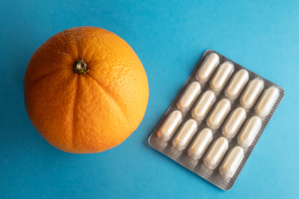 An orange and pills