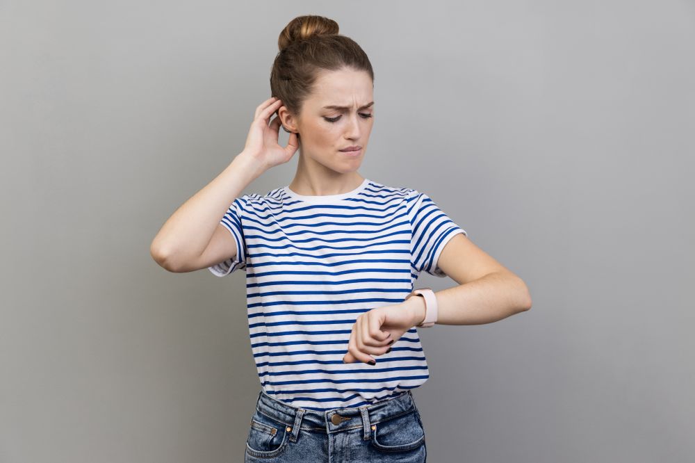 Woman looking at clock