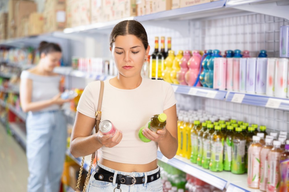 Woman comparing drink benefits