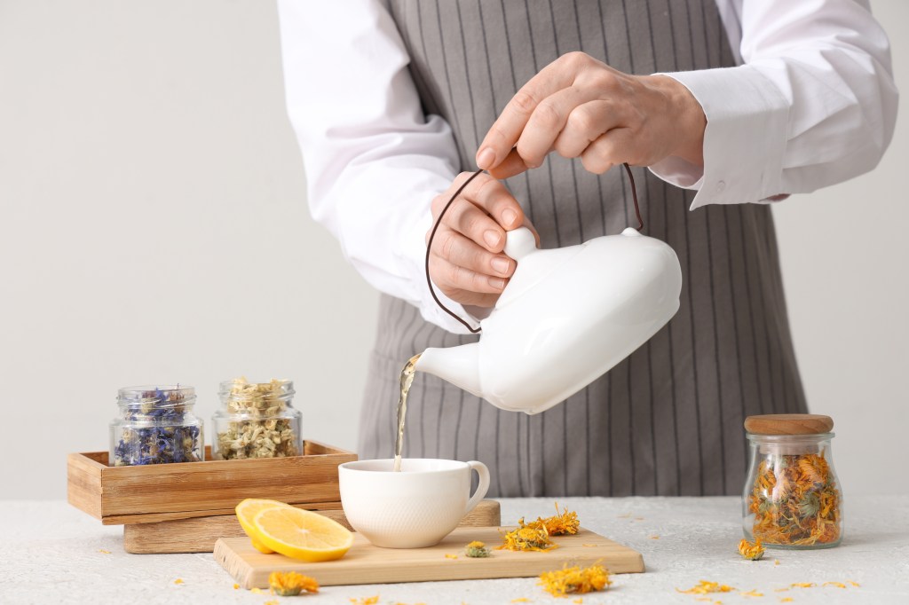 Woman preparing herbal tea