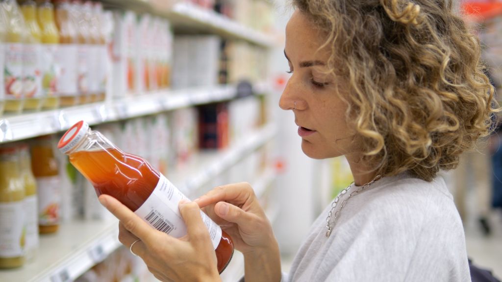 Woman reading a nutrition label