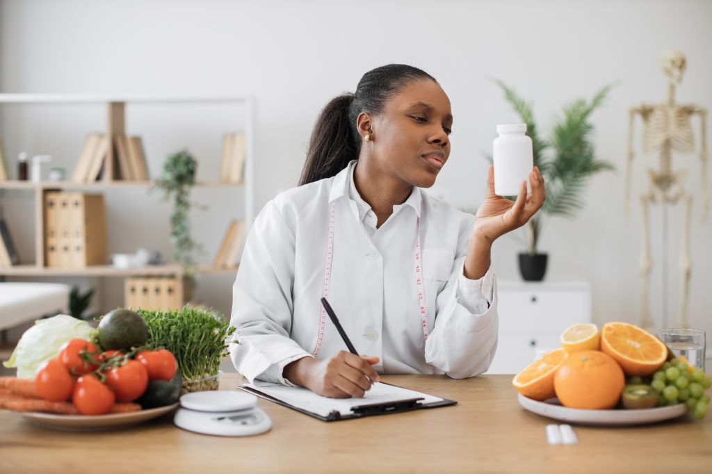 Woman looking at a supplement  