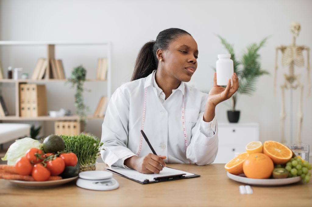 Woman looking at a supplement