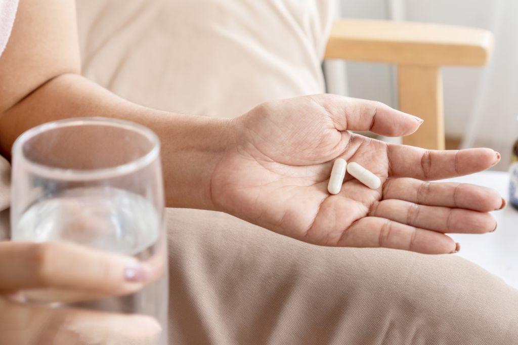 Hand holding capsules