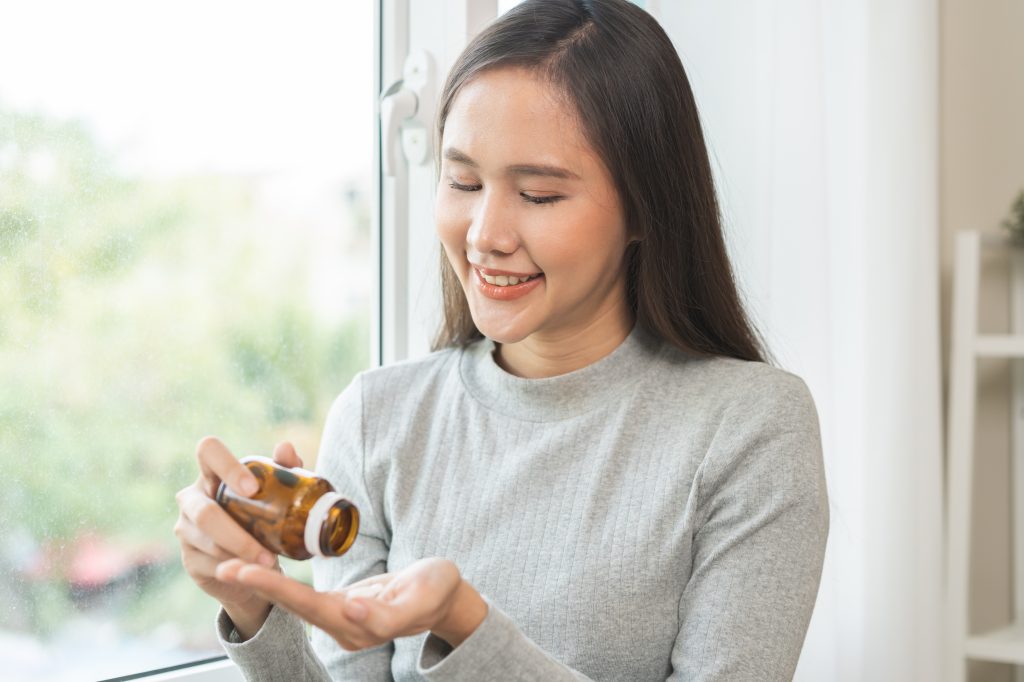 Woman taking supplements