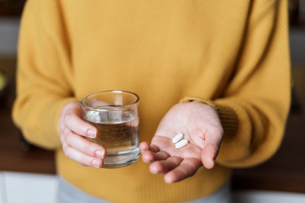 Hand holding supplements