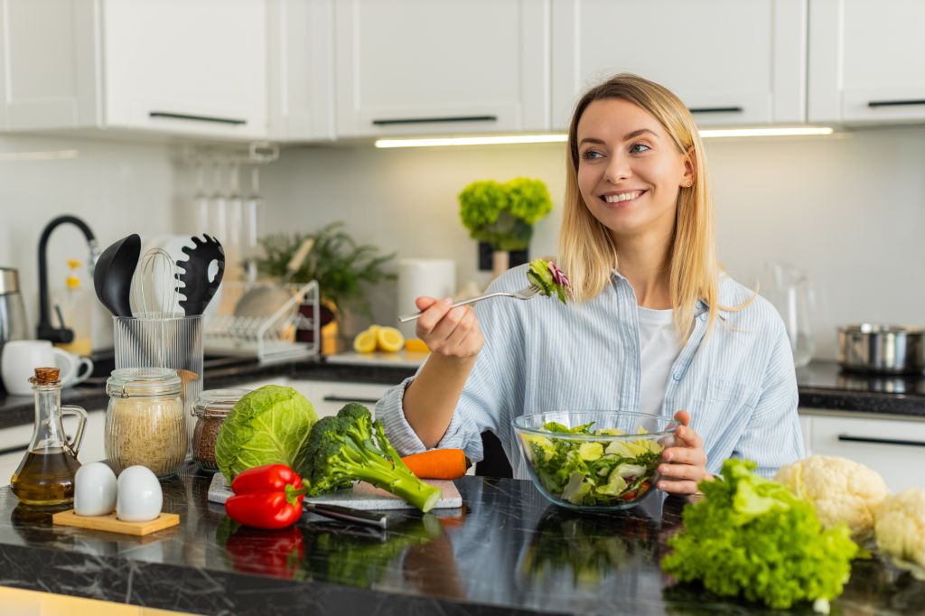 Woman eating leafy greens