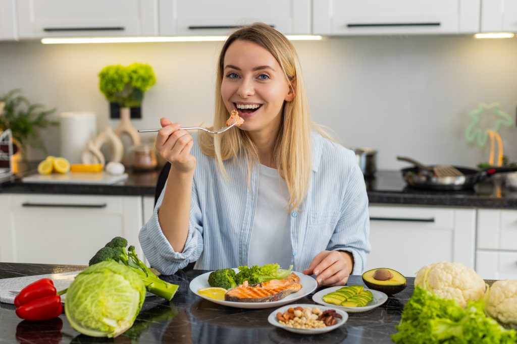 Woman eating fish
