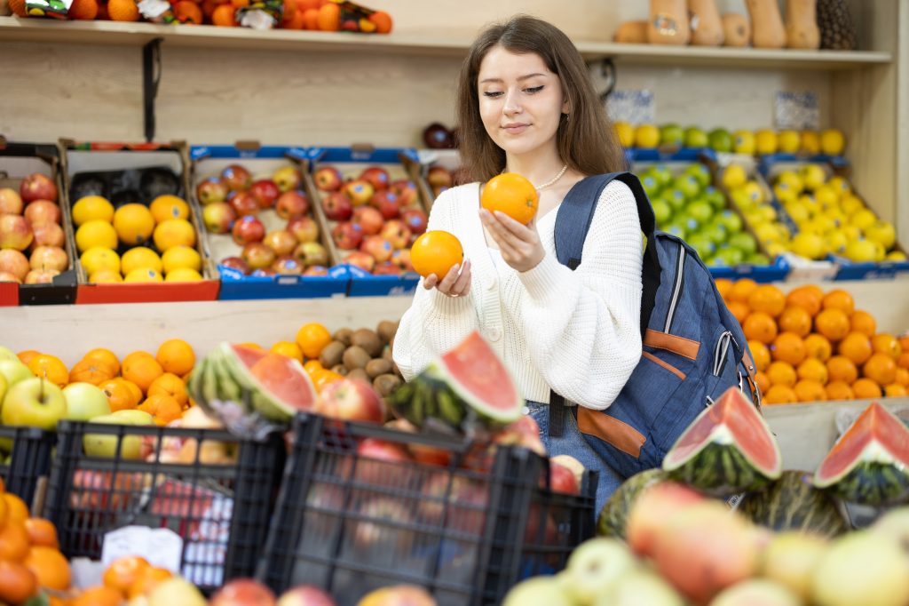 Woman buying fruits