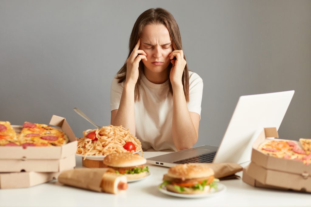 Woman struggling with overeating