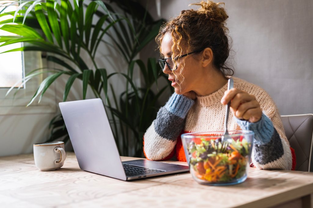 Woman who is distracted while eating