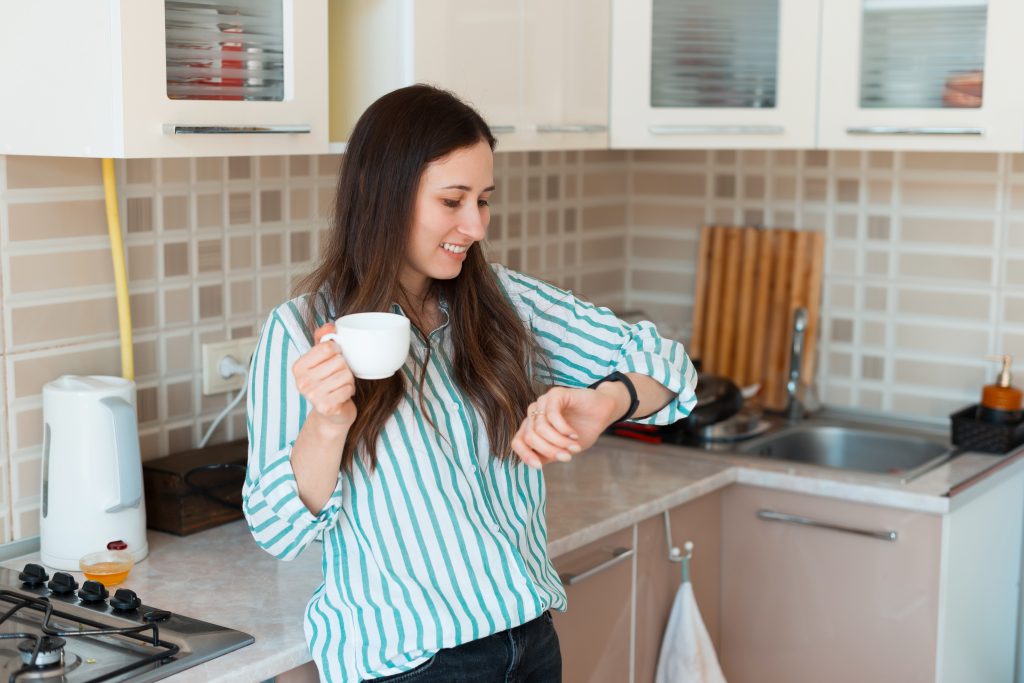 Woman checking her watch on a fast