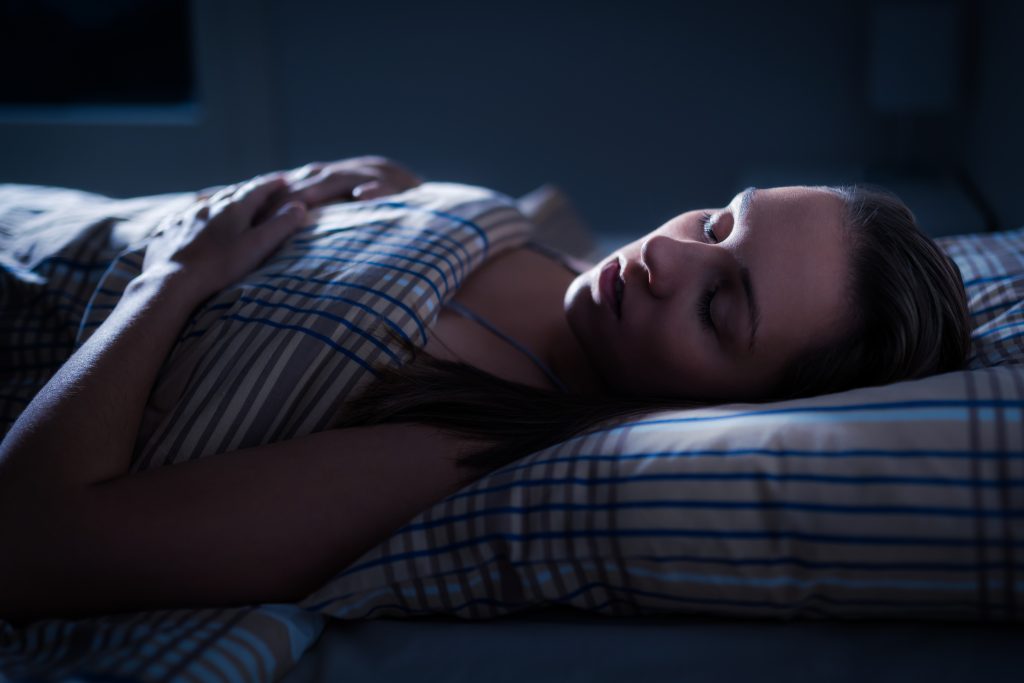 Woman sleeping in bed 