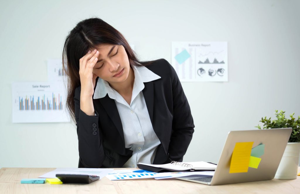 Tired woman under artificial light