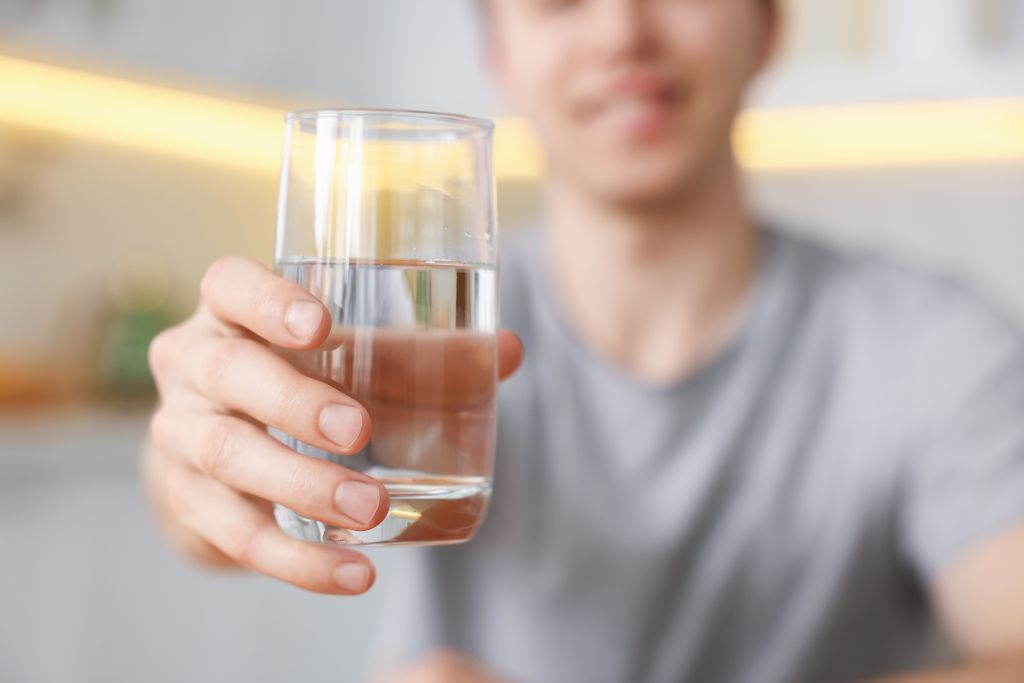 Man holding glass of water