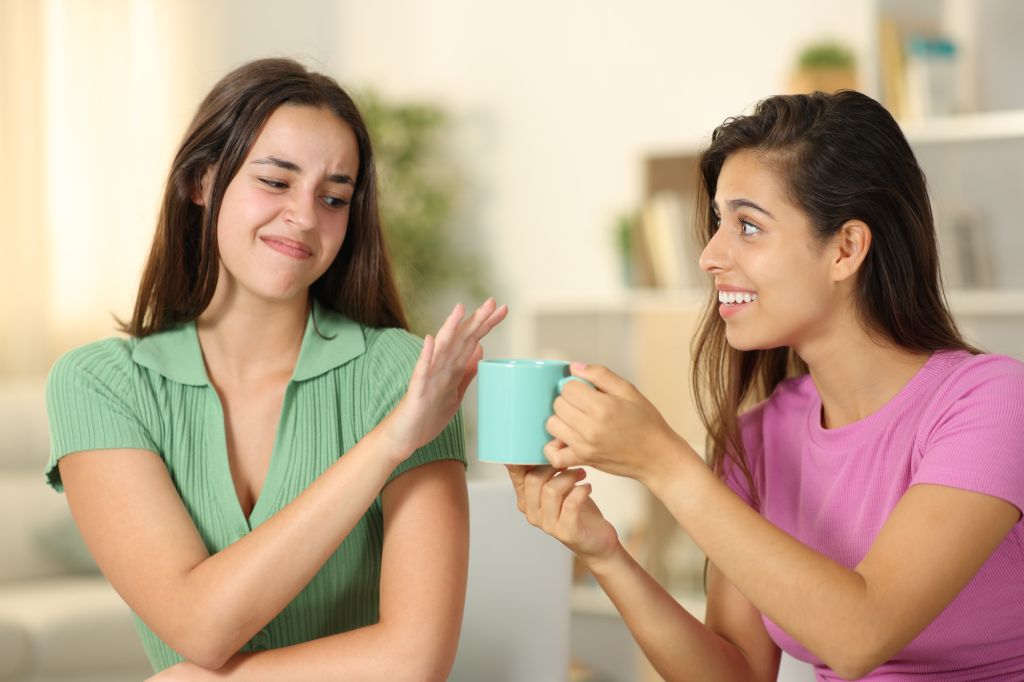 Woman saying no to coffee