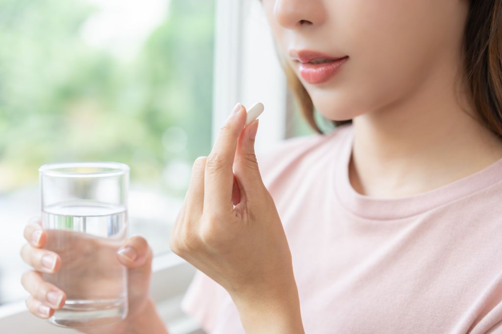 Woman taking pill
