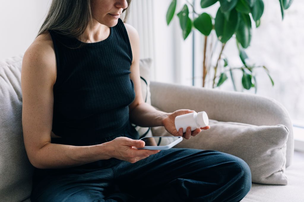 A woman researching a supplement